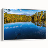 Vintage poster art of Raleigh, North Carolina, featuring colorful art on a white framed canvas, ideal for living room decor.