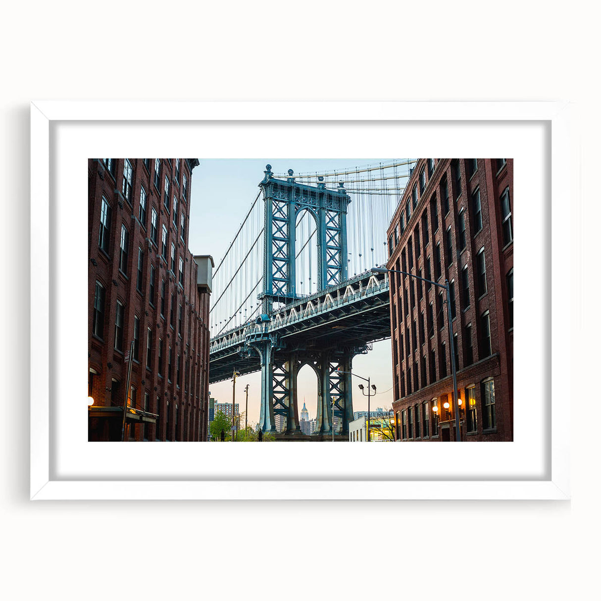 Abstract art print of Brooklyn Bridge in muted gray and blue tones, framed in white, ideal for dining room decor.