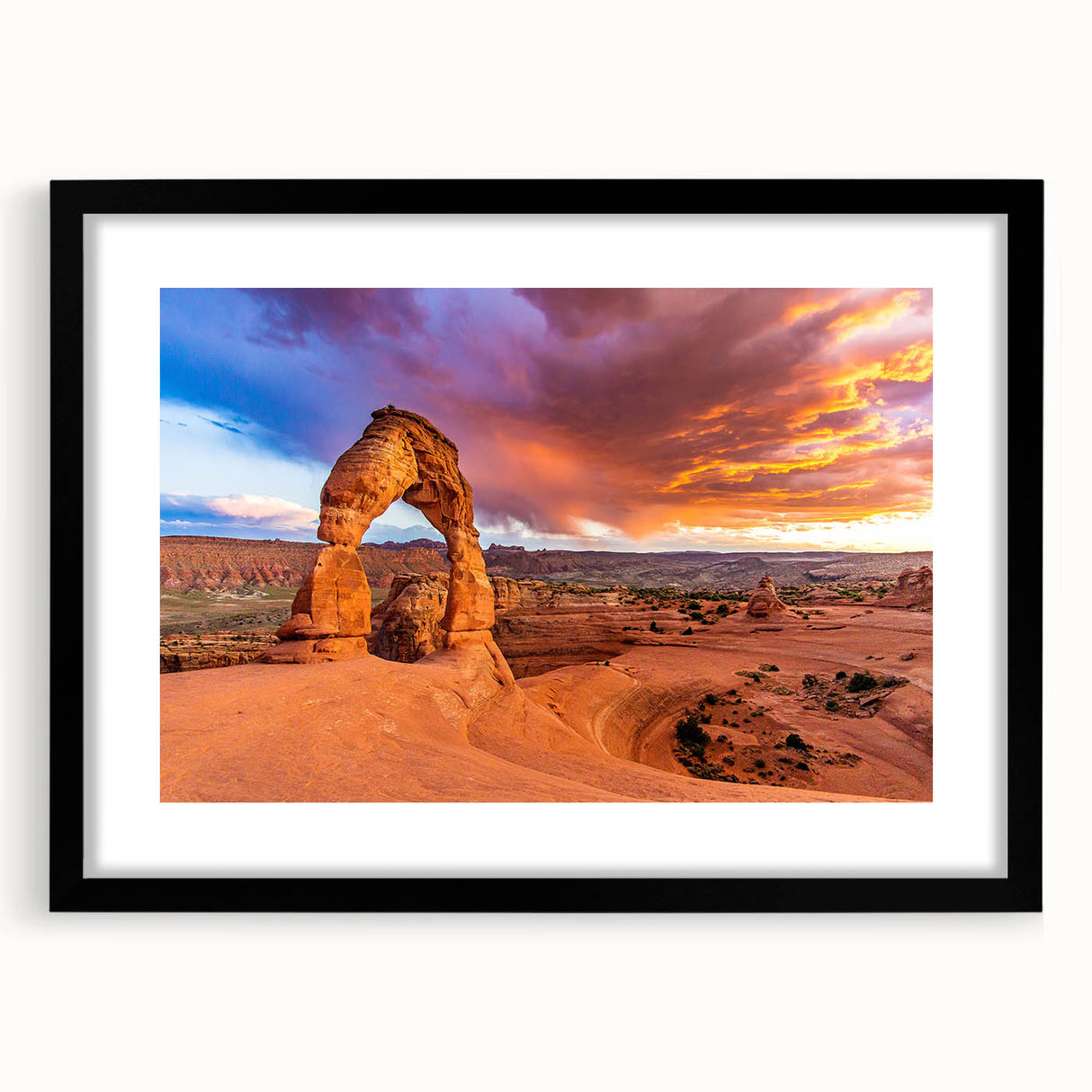 Extra large abstract print of Arches National Park in vibrant, colorful hues on a black framed canvas.