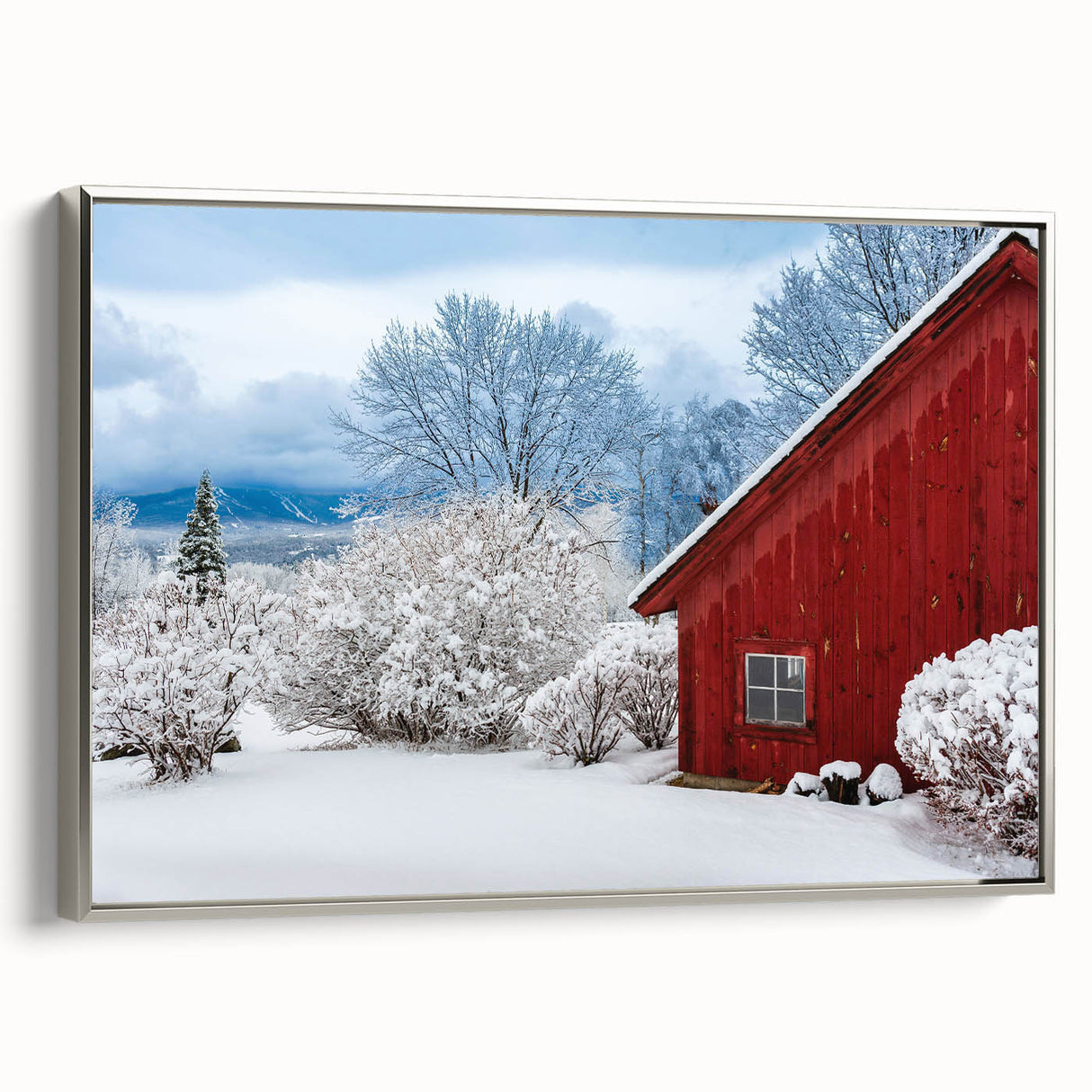 Framed canvas featuring a vintage-style landscape painting of Vermont, with vibrant autumn colors and silver frame.