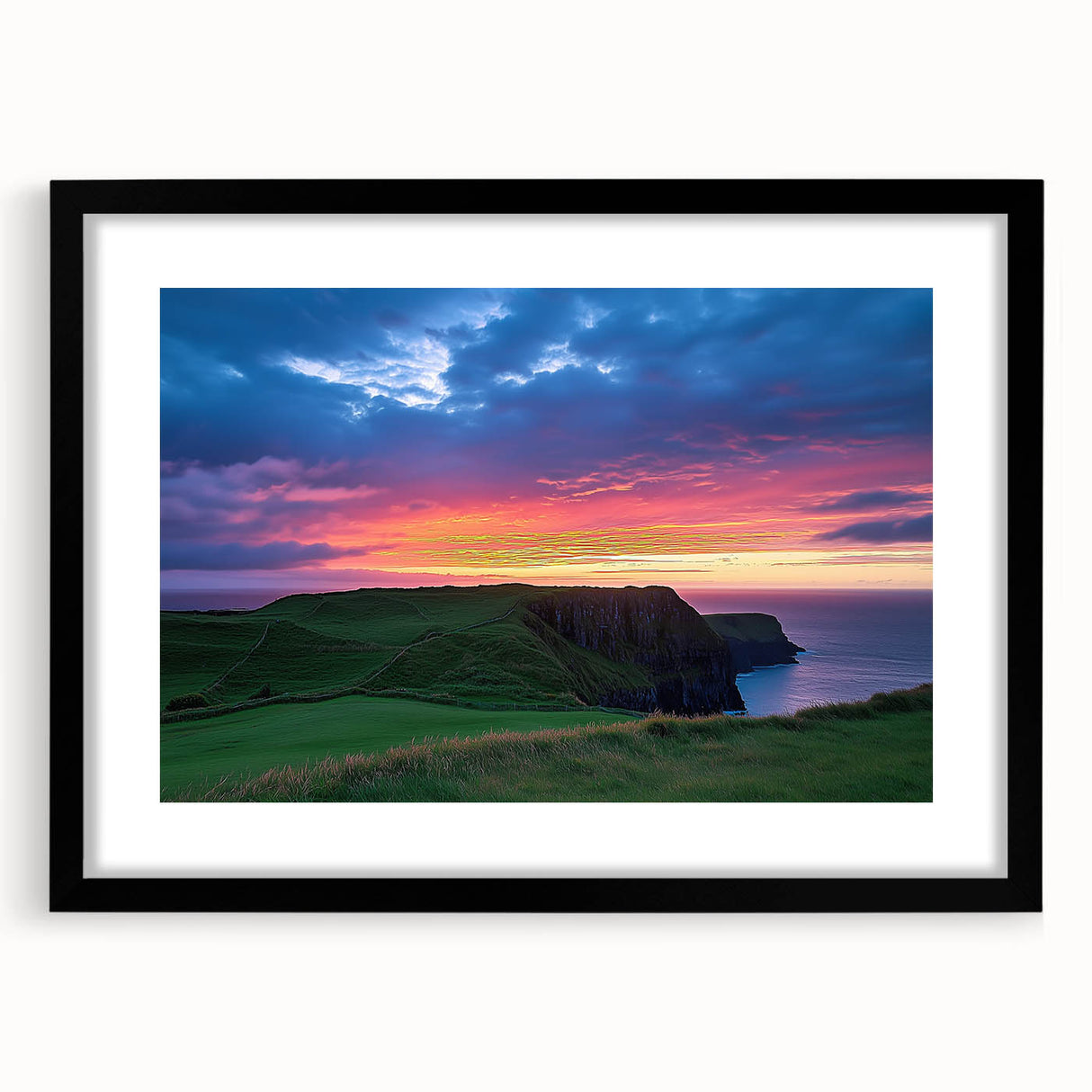 Black-framed landscape artwork showcasing dramatic cliffs and a serene sky, elegantly presented with a mat for a polished look, ideal for modern home decor.