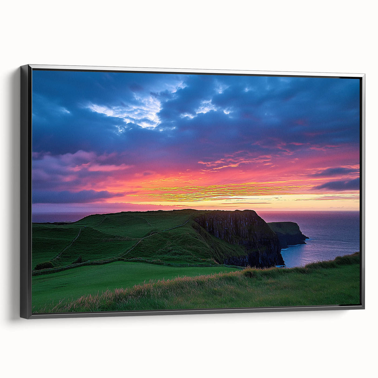 Framed canvas art depicting a stunning landscape of rugged cliffs under a dramatic sky, showcasing vibrant colors and intricate details, perfect for home decor.