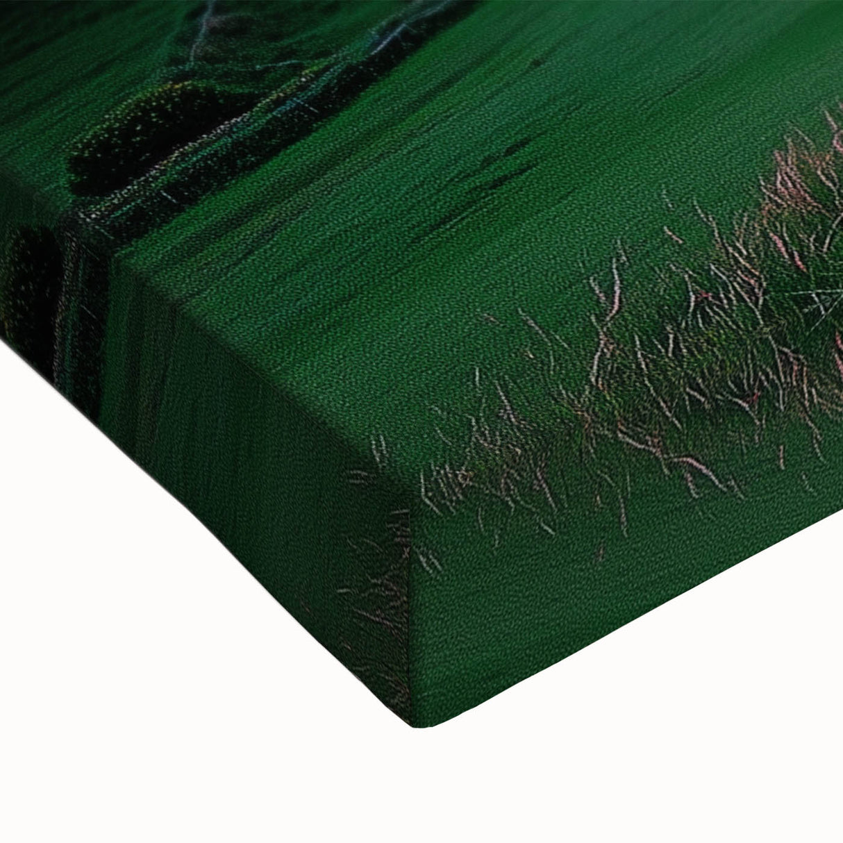 Close-up view of a stretched canvas artwork depicting dramatic cliffs in a lush landscape, showcasing vibrant colors and intricate details that enhance any interior decor.