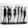 Abstract figurative artwork displayed in a glass frame, showcasing vibrant colors and dynamic shapes, perfect for modern home decor and artistic settings.