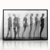 Framed acrylic artwork showcasing an abstract figurative design in black, set against a sleek modern backdrop, ideal for contemporary home decor.