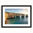 Black-framed landscape artwork showcasing dramatic cliffs and vibrant colors, elegantly matted for a refined presentation, ideal for home decor.