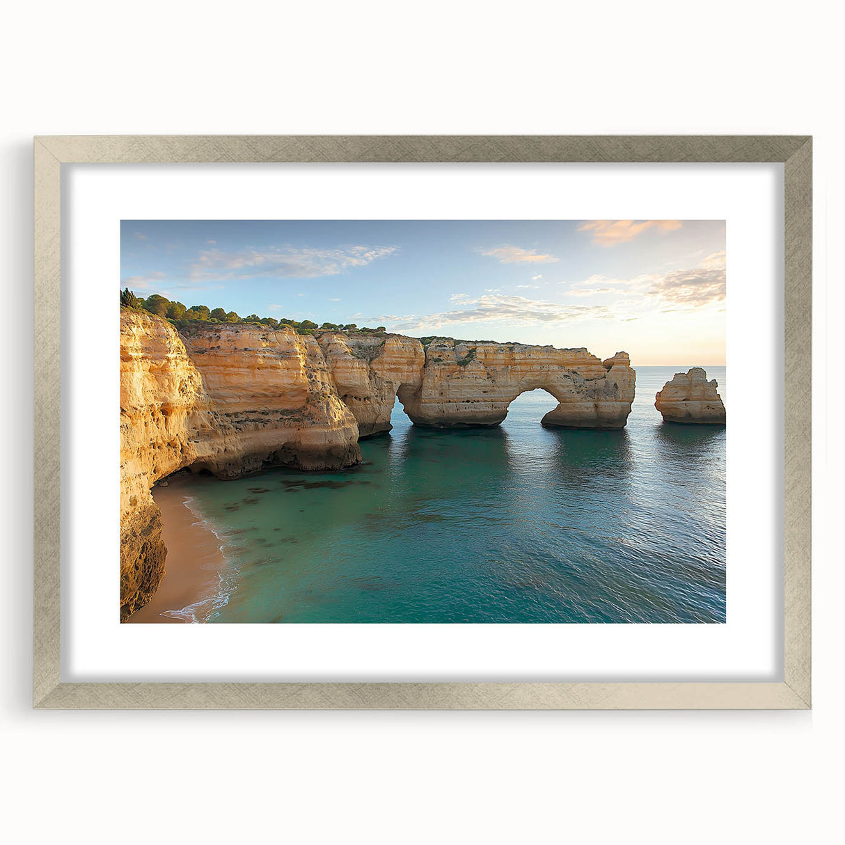 Framed landscape artwork showcasing dramatic cliffs in a silver frame with a mat, highlighting intricate details and vibrant colors, perfect for home decor.