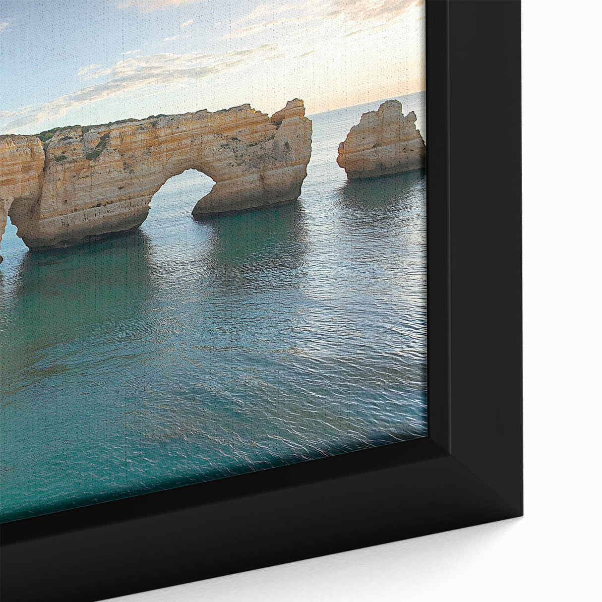 Close-up view of a framed canvas artwork depicting vibrant landscapes with dramatic cliffs, showcasing rich colors and intricate details, perfect for home decor.