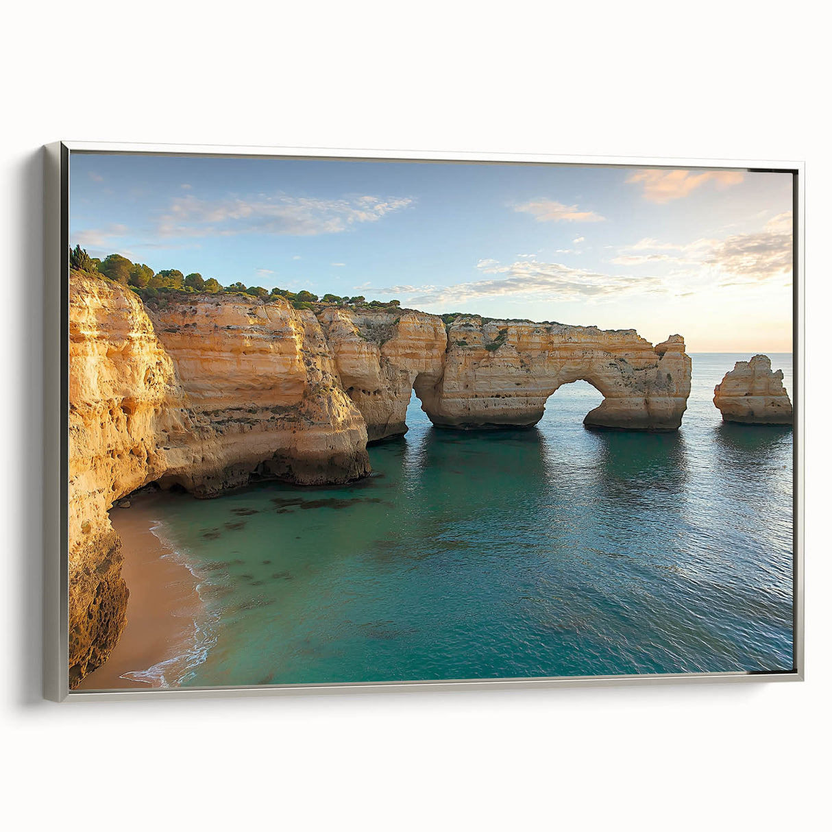 Framed canvas artwork depicting a stunning landscape of cliffs, showcasing vibrant colors and intricate details, with a sleek silver frame enhancing its elegance.