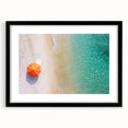 Black-framed landscape artwork showcasing serene beaches with soft waves, featuring a white mat for an elegant finish, perfect for home decor enhancement.