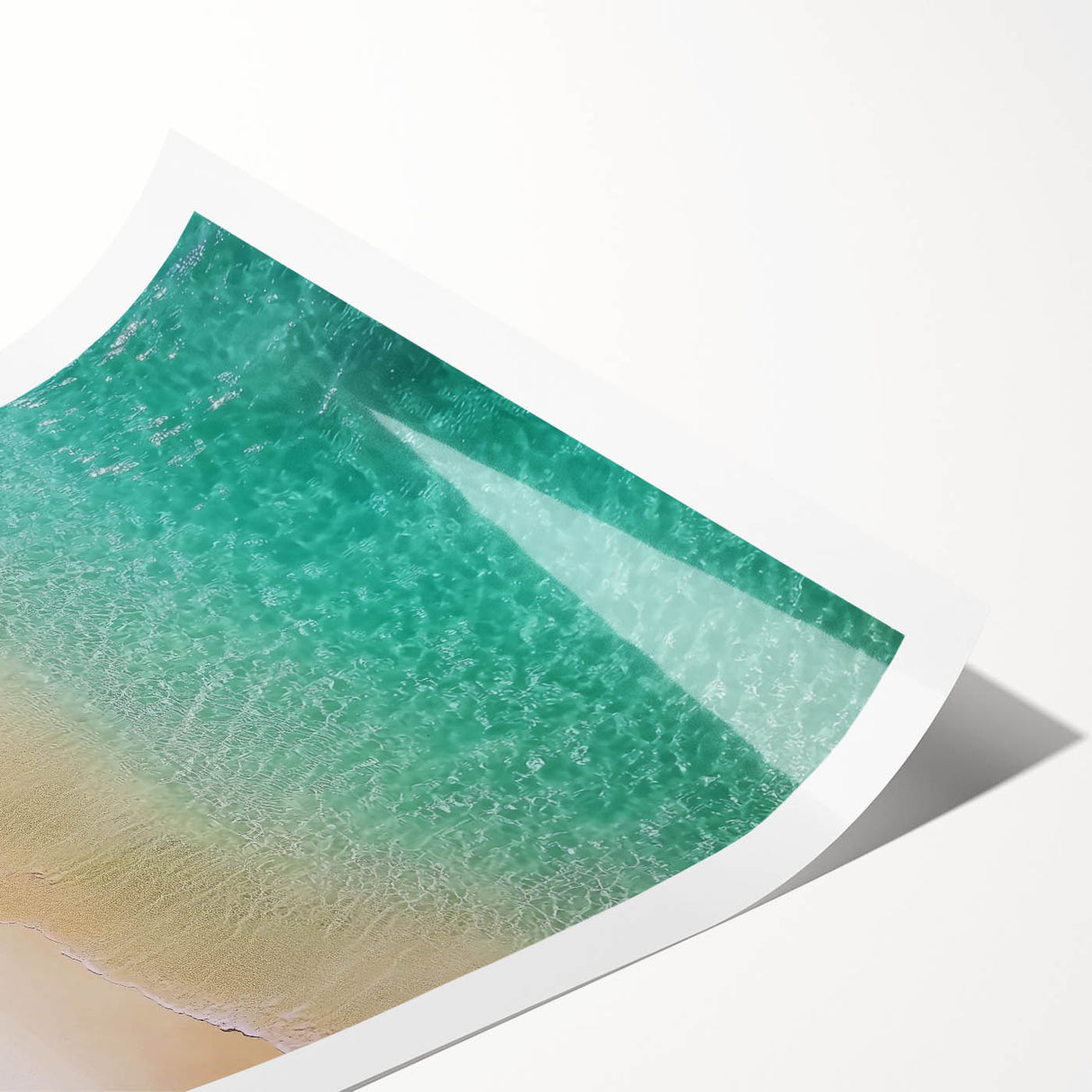 Stunning rolled print of a tranquil beach landscape, showcasing vibrant blue waters and golden sands, perfect for enhancing coastal-themed decor in homes or offices.