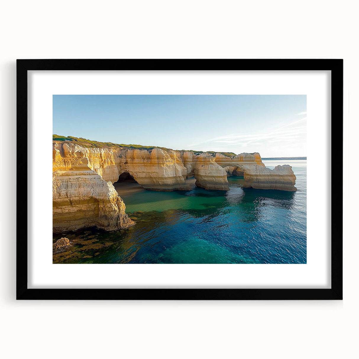 Black-framed landscape art print showcasing dramatic cliffs against a vibrant sunset, elegantly matted for a refined presentation, perfect for home decor.