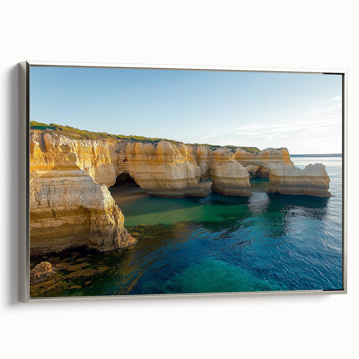Framed canvas artwork depicting dramatic cliffs and landscapes, featuring a sleek silver frame and showcasing vibrant colors that enhance any living space. Ideal for home decor enthusiasts seeking nature-inspired art.