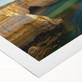 Stunning rolled canvas artwork depicting dramatic cliffs and vibrant landscapes, showcasing rich colors and textures, perfect for home decor or art enthusiasts.