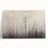 Stretched canvas artwork showcasing vibrant abstract florals in shades of pink, blue, and gold, elegantly leaning against a neutral wall, perfect for modern home decor.