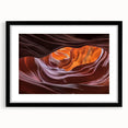 Black-framed landscape print showcasing a stunning canyon view, featuring rich earth tones and dramatic rock formations, designed to enhance any home décor.
