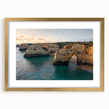 Elegant gold-framed landscape art print showcasing majestic cliffs and serene skies, perfect for home decor or office spaces, highlighting natural beauty and tranquility.