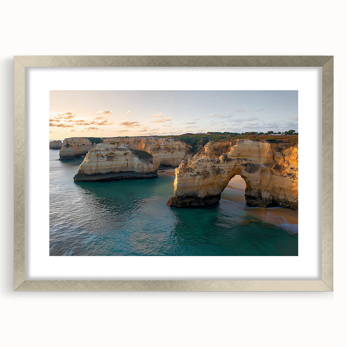 Framed landscape artwork showcasing majestic cliffs, presented in a silver frame with a mat for added elegance, ideal for home or office decoration.