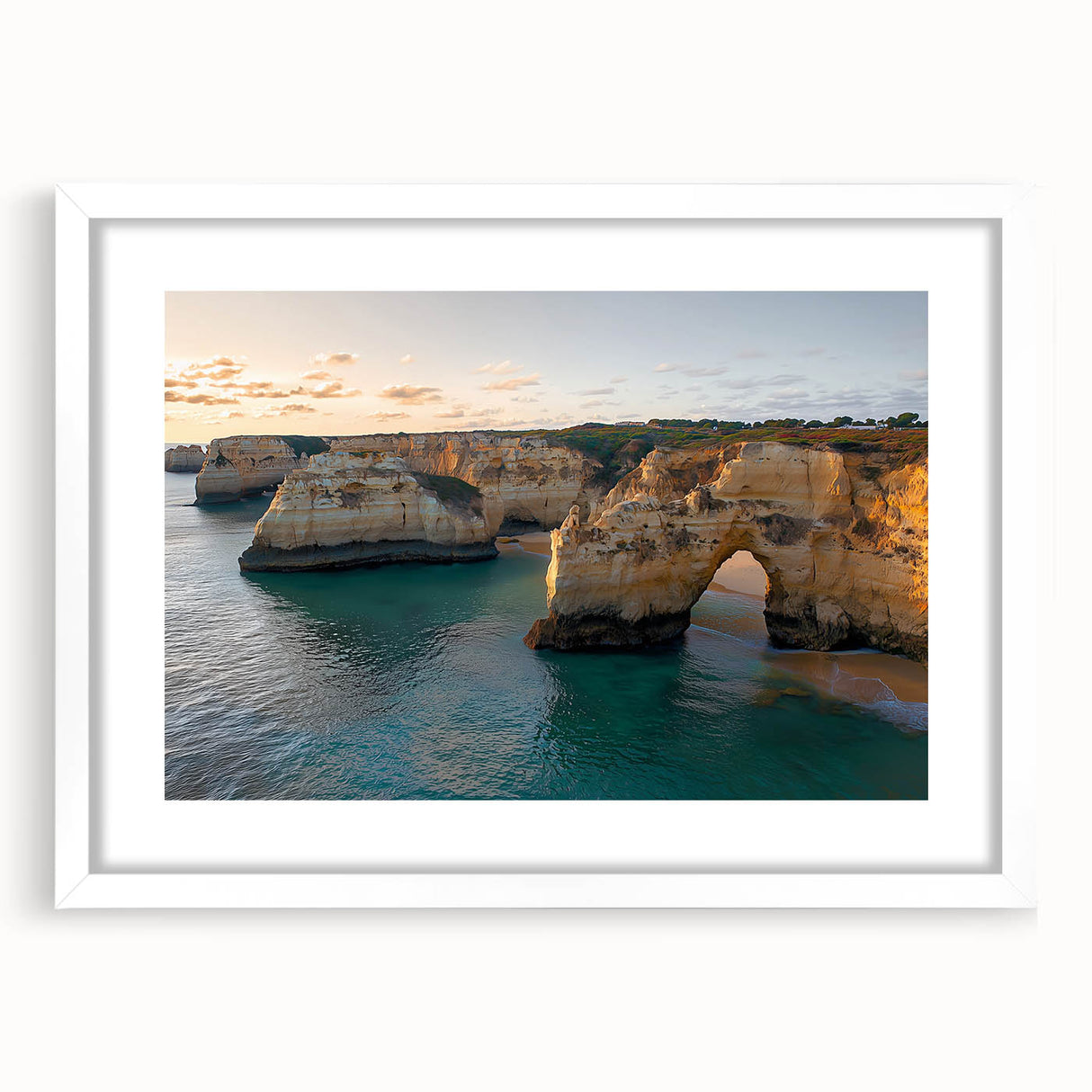Framed landscape artwork showcasing dramatic cliffs against a serene sky, presented with a white mat and sleek black frame, ideal for modern decor.