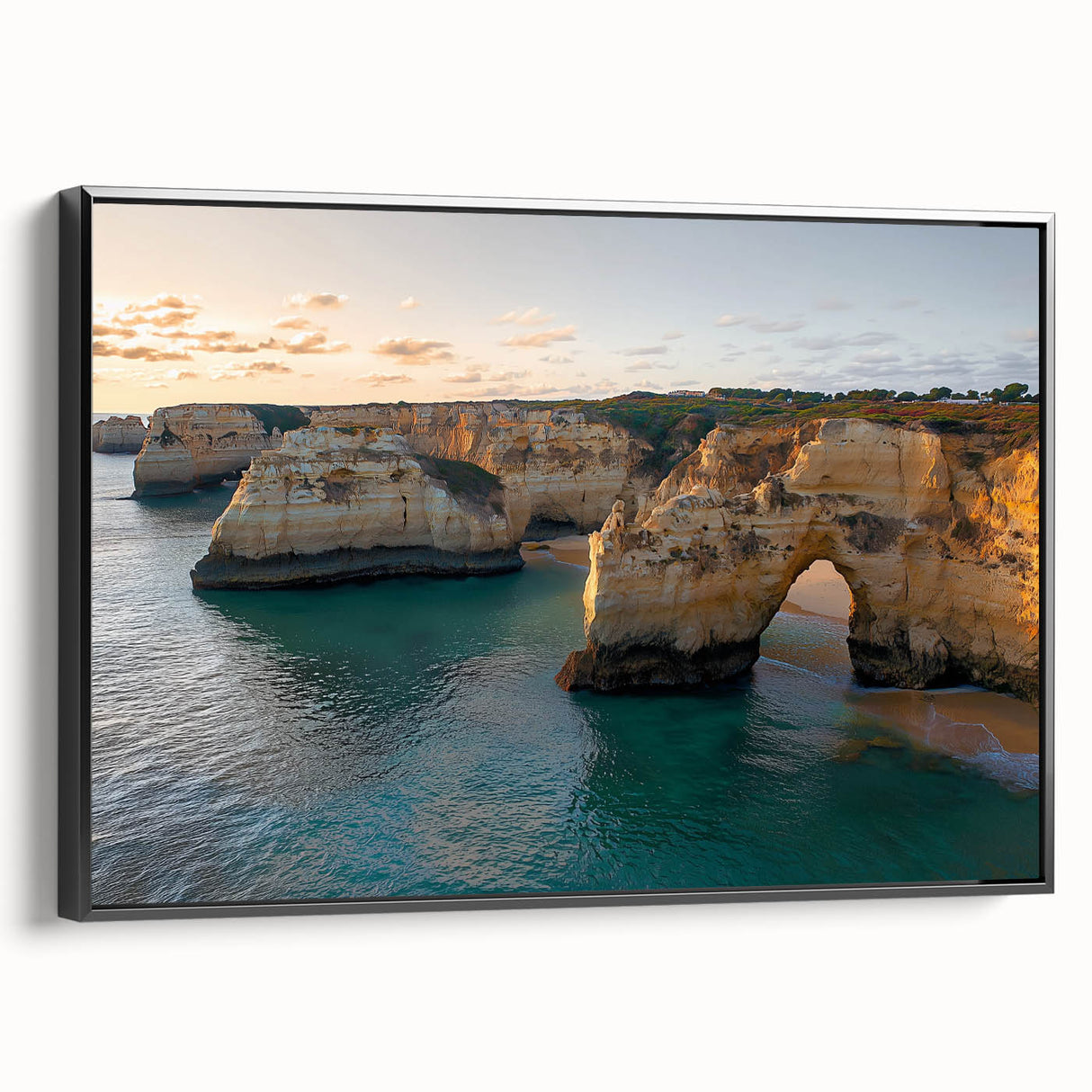 Framed canvas artwork showcasing dramatic cliffs and landscapes in muted tones, featuring a sleek black frame, perfect for enhancing modern home decor.
