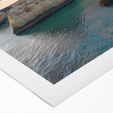 Vibrant rolled canvas artwork depicting a stunning landscape with dramatic cliffs under a clear blue sky, elegantly packaged in a protective cardboard tube. Perfect for home decor.