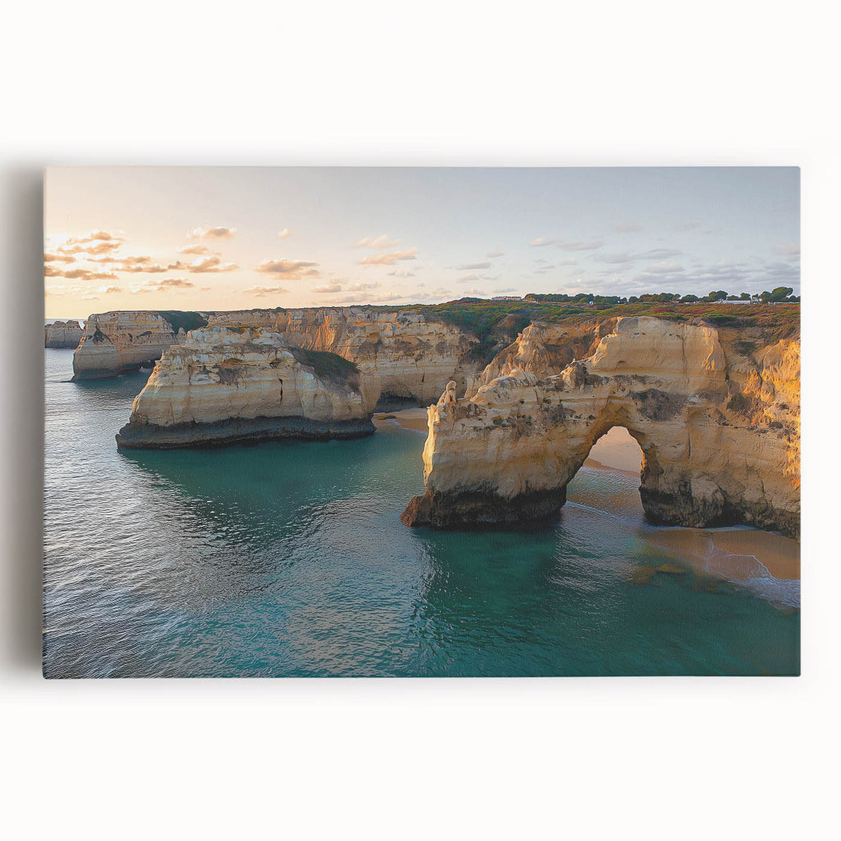 Stretched canvas artwork showcasing a breathtaking landscape of dramatic cliffs under a vibrant sunset, perfect for home decor and nature enthusiasts.