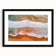 Black-framed landscape artwork depicting serene beaches with soft waves and golden sand, featuring a white mat for an elegant presentation, ideal for coastal decor.