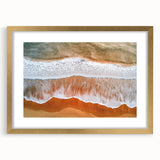 Elegant landscape artwork of serene beaches framed in a gold mat, showcasing soft blues and sandy tones, perfect for enhancing modern home decor.