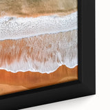 Close-up of a framed canvas depicting a serene beach landscape with vibrant colors and intricate details, perfect for home decor and beach-themed interiors.