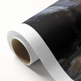 A rolled canvas print showcasing a vibrant landscape of canyons in rich earth tones, expertly wrapped in a protective cardboard tube for safe shipment. Ideal for home decor enthusiasts looking to enhance their space with stunning nature-inspired artwork.