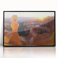 Framed acrylic artwork showcasing a stunning landscape of canyons in vibrant hues, featuring a sleek black frame that enhances its visual appeal, perfect for home decor.