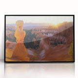 Framed acrylic artwork showcasing a stunning landscape of canyons in vibrant hues, featuring a sleek black frame that enhances its visual appeal, perfect for home decor.