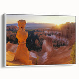 Framed landscape canvas art showcasing stunning canyons in vibrant earth tones, viewed from the side. Perfect for enhancing home decor with natural beauty.