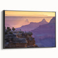 Framed landscape canvas art showcasing vibrant canyons in rich earth tones, set against a sleek black frame, perfect for enhancing home decor.