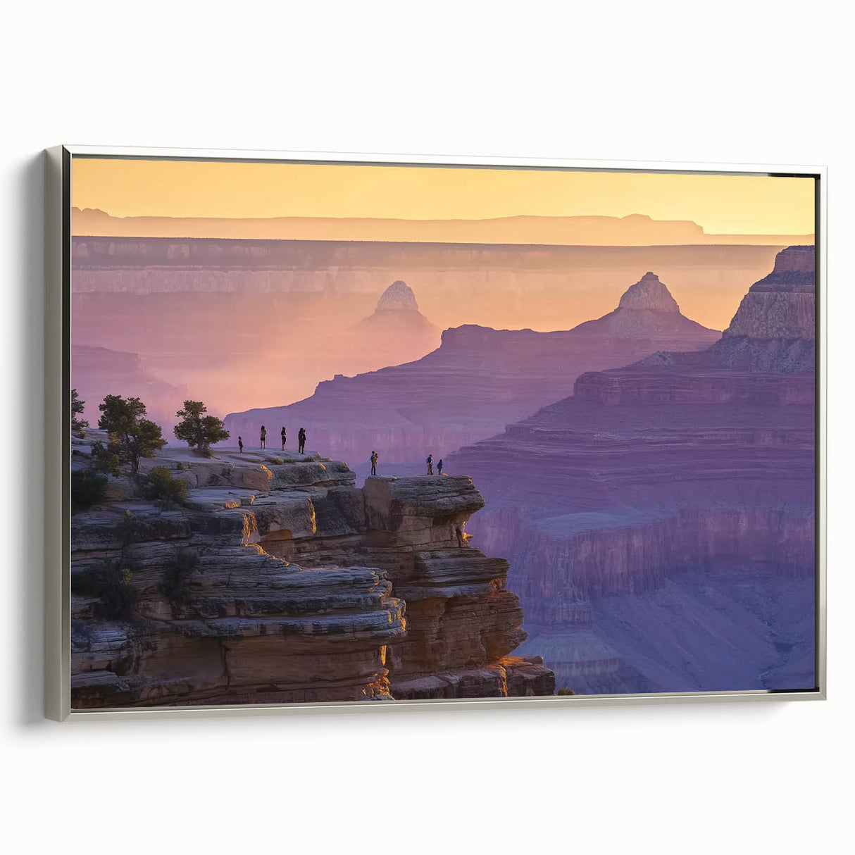 Framed landscape canvas art depicting vibrant canyons in warm hues, showcasing a silver frame that enhances the overall aesthetic, perfect for modern home decor.
