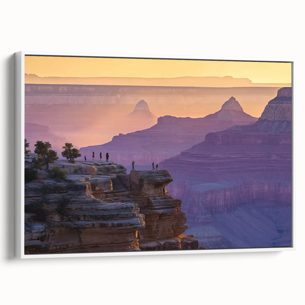 Framed canvas artwork depicting a stunning landscape of canyons, showcasing vibrant colors and intricate details, presented with a sleek white frame, ideal for home decor.