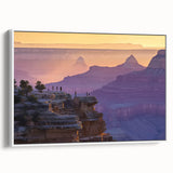 Framed canvas artwork depicting a stunning landscape of canyons, showcasing vibrant colors and intricate details, presented with a sleek white frame, ideal for home decor.