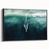 Framed canvas artwork showcasing a serene beach landscape with soft blue skies and gentle waves, presented in a sleek black frame for an elegant touch. Ideal for coastal-themed decor.