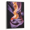 Framed canvas artwork showcasing a breathtaking landscape of canyons in vibrant colors, set against a sleek black frame, perfect for enhancing modern home decor.