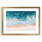 Elegant landscape print of a serene beach scene framed in a gold mat, showcasing soft sand and gentle waves, perfect for coastal home decor. Ideal for enhancing living spaces with a tranquil atmosphere.