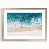 Framed landscape artwork depicting serene beaches with a silver mat, showcasing vibrant colors and details, perfect for coastal home decor. Ideal for enhancing living spaces with a touch of tranquility and elegance.