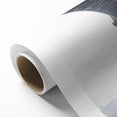 Rolled canvas showcasing a vibrant landscape bridge design, featuring rich colors and intricate details, packaged securely in a protective cardboard tube for safe shipping.