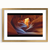 Landscape print of canyons framed in elegant gold, showcasing vibrant earthy tones. Ideal for home decor, it adds a touch of nature-inspired sophistication.