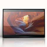 Framed acrylic artwork showcasing a vibrant landscape of canyons with a black frame, highlighting rich colors and intricate details, perfect for home decor.