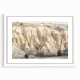Framed landscape artwork depicting vibrant canyons, encased in a white mat, perfect for enhancing home decor. Ideal for nature lovers and art enthusiasts.