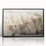 Framed acrylic artwork showcasing a vibrant landscape of canyons in rich earth tones, presented in a sleek black frame, ideal for modern home decor accentuating natural beauty. Perfect for enhancing living room aesthetics or gallery wall displays.