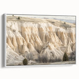 Framed landscape canvas art depicting colorful canyons in earthy tones, showcasing vibrant textures and depth, ideal for enhancing home decor aesthetics.