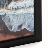 Close-up of a framed landscape canvas depicting serene beaches at sunset, showcasing vivid colors and intricate details, perfect for coastal home decor.