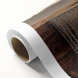 Rolled canvas artwork showcasing a vibrant landscape bridge design, featuring lush greenery and a serene river, elegantly packaged in a protective cardboard tube.