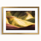 Gold-framed landscape art featuring majestic canyons, elegantly matted for a refined presentation, ideal for enhancing home decor with natural beauty.